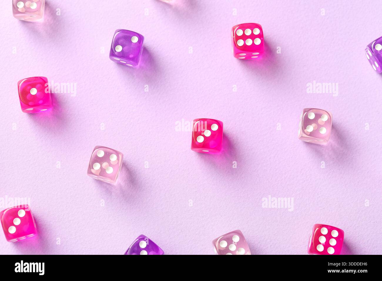 Different game dices on lilac background Stock Photo