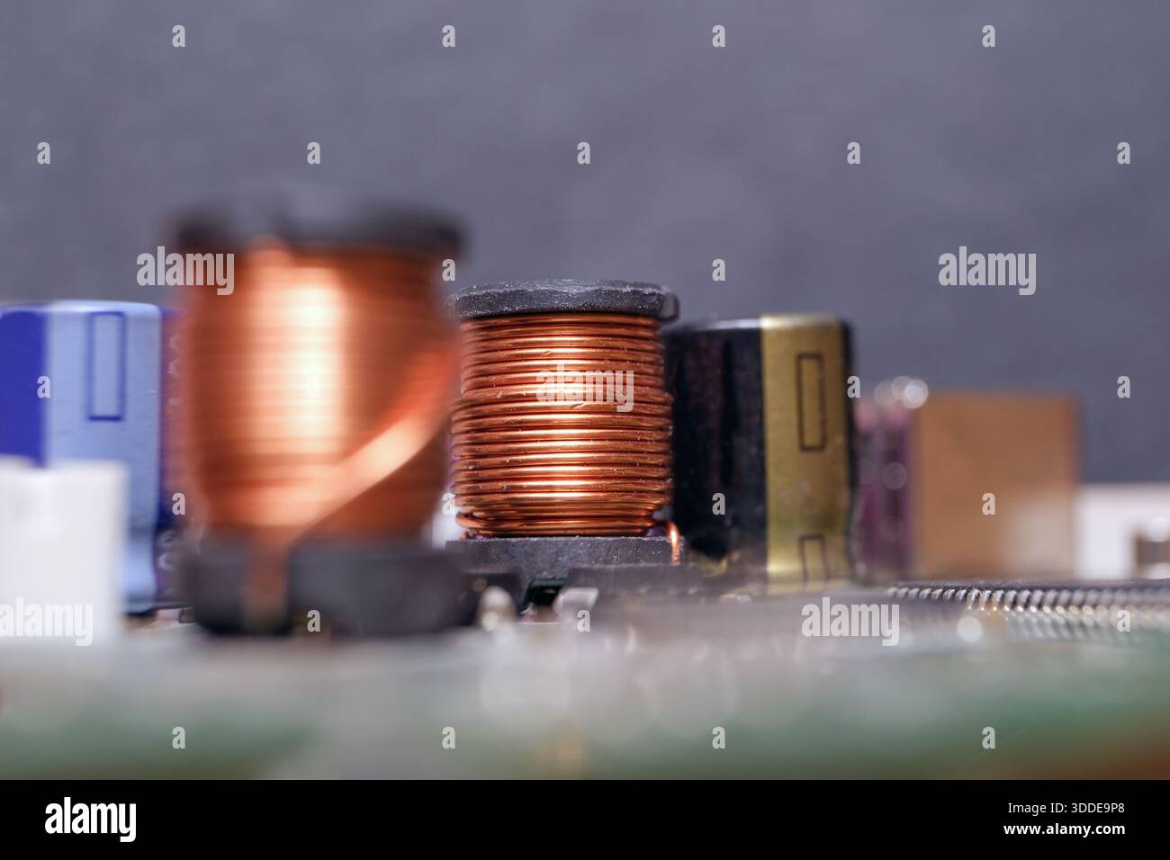 Copper inductor in high-tech electronic device. Using copper mines in technology. Stock Photo