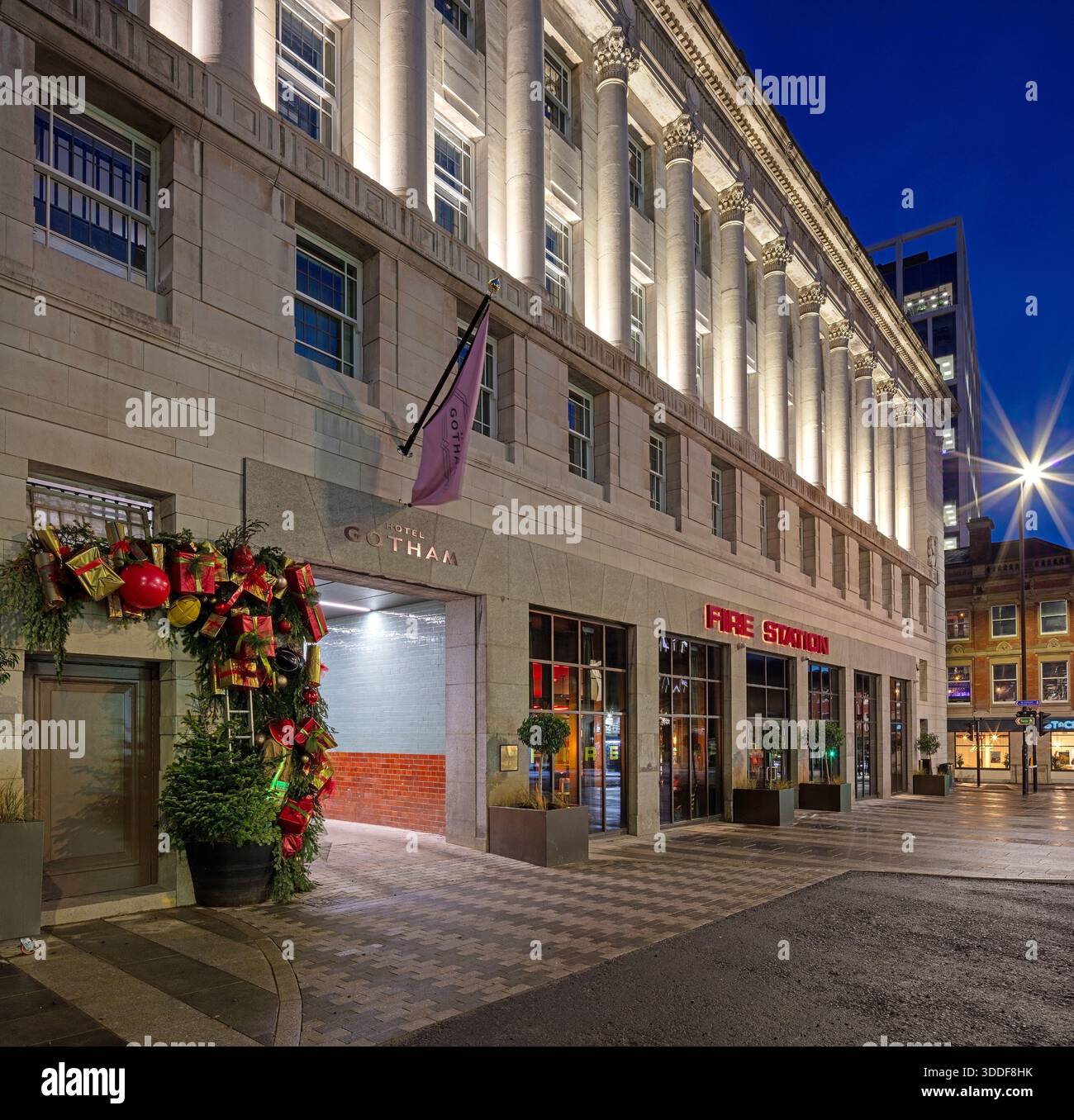 A view at dusk at Christmas of the exterior of the luxury boutique Hotel Gotham Newcastle in Newcastle upon Tyne with the front of the hotel floodlit Stock Photo