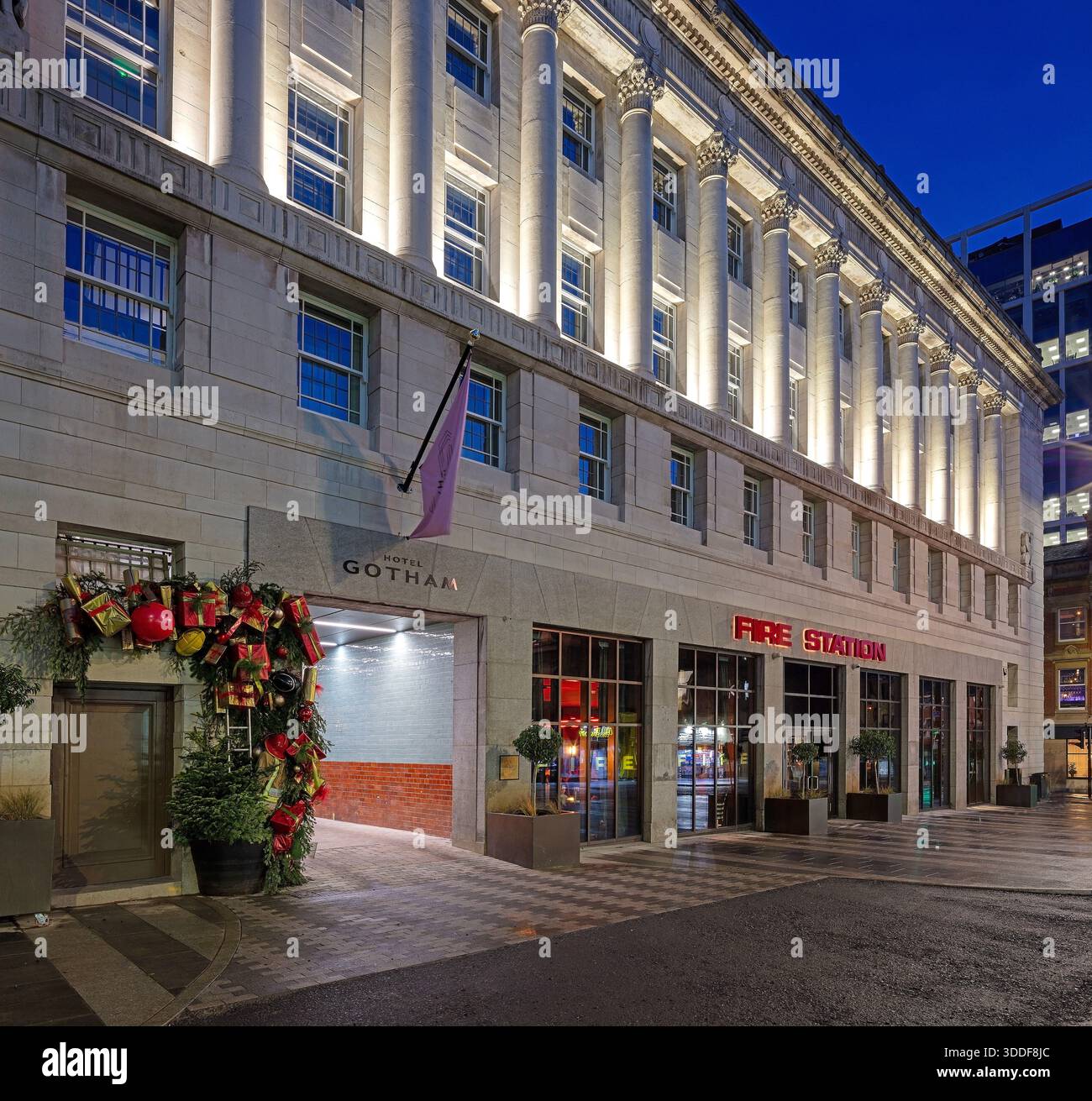 A view at dusk at Christmas of the exterior of the luxury boutique Hotel Gotham Newcastle in Newcastle upon Tyne with the front of the hotel floodlit Stock Photo