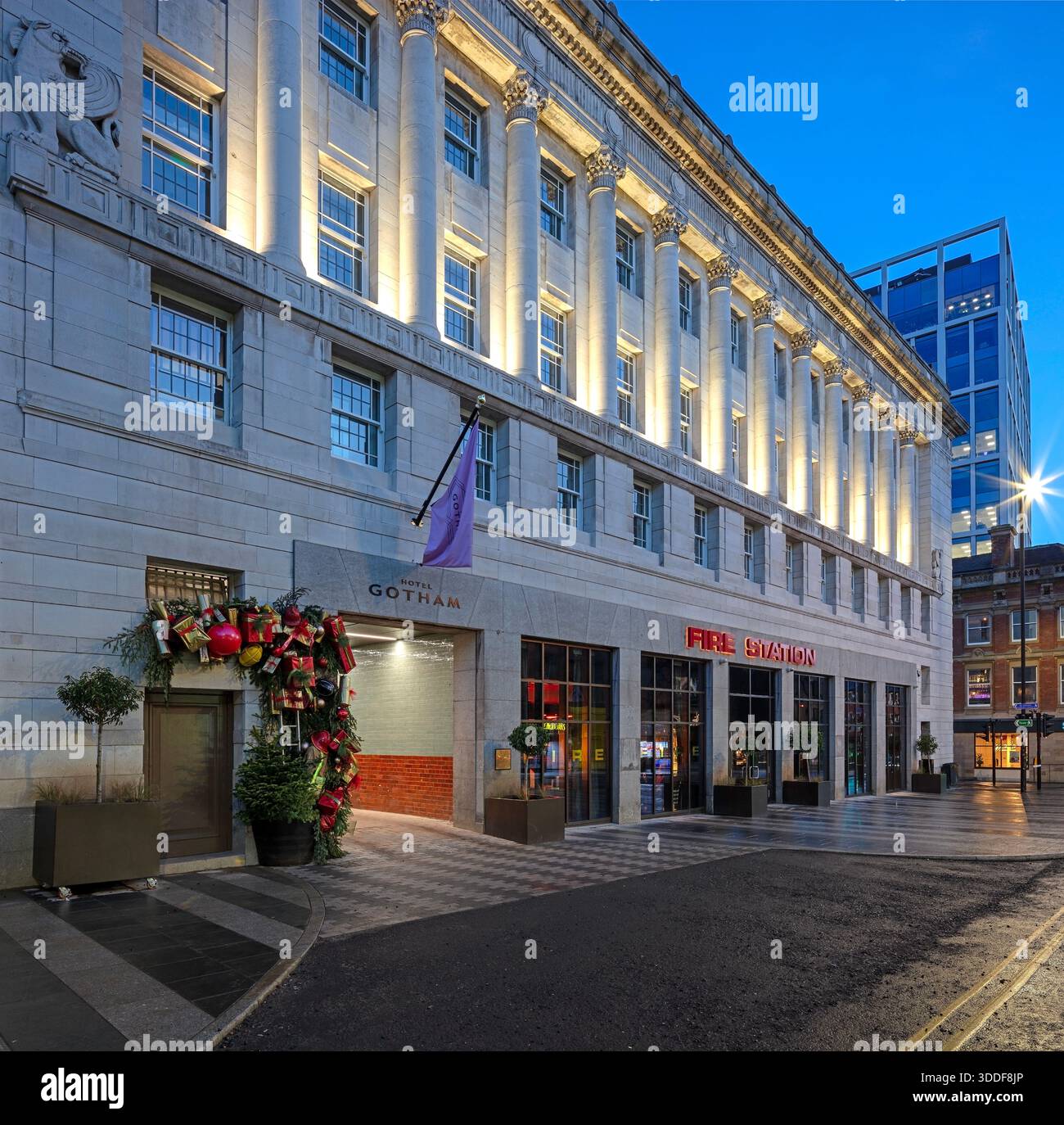 A view at dusk at Christmas of the exterior of the luxury boutique Hotel Gotham Newcastle in Newcastle upon Tyne with the front of the hotel floodlit Stock Photo