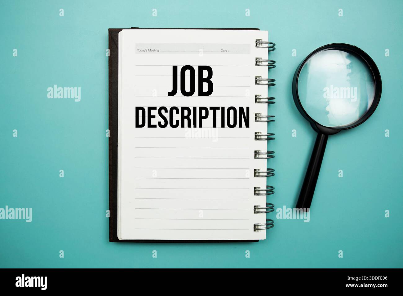 Job Description text written on notepad with alarm clock Stock Photo