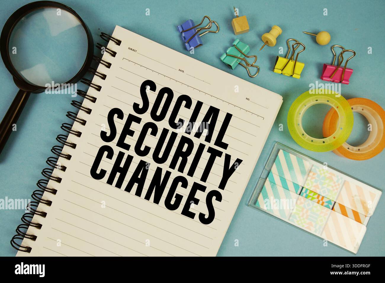 Social Security Changes text with magnifying glass on blue background Stock Photo