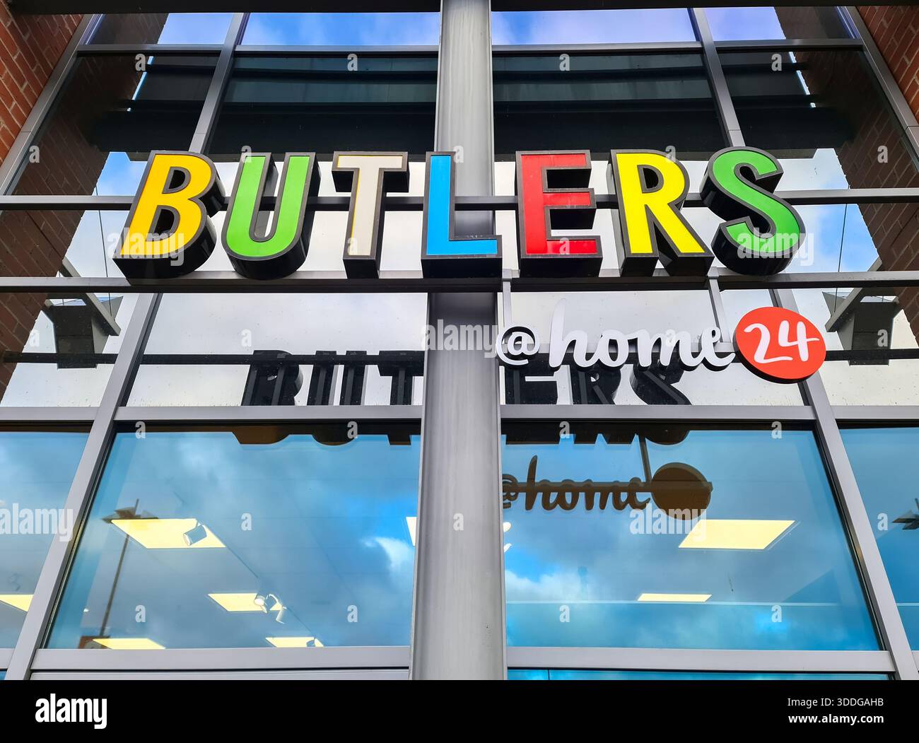 Kiel, Germany - 29. December 2025: Butlers and home24 brand signs displayed on a modern commercial building exterior Stock Photo