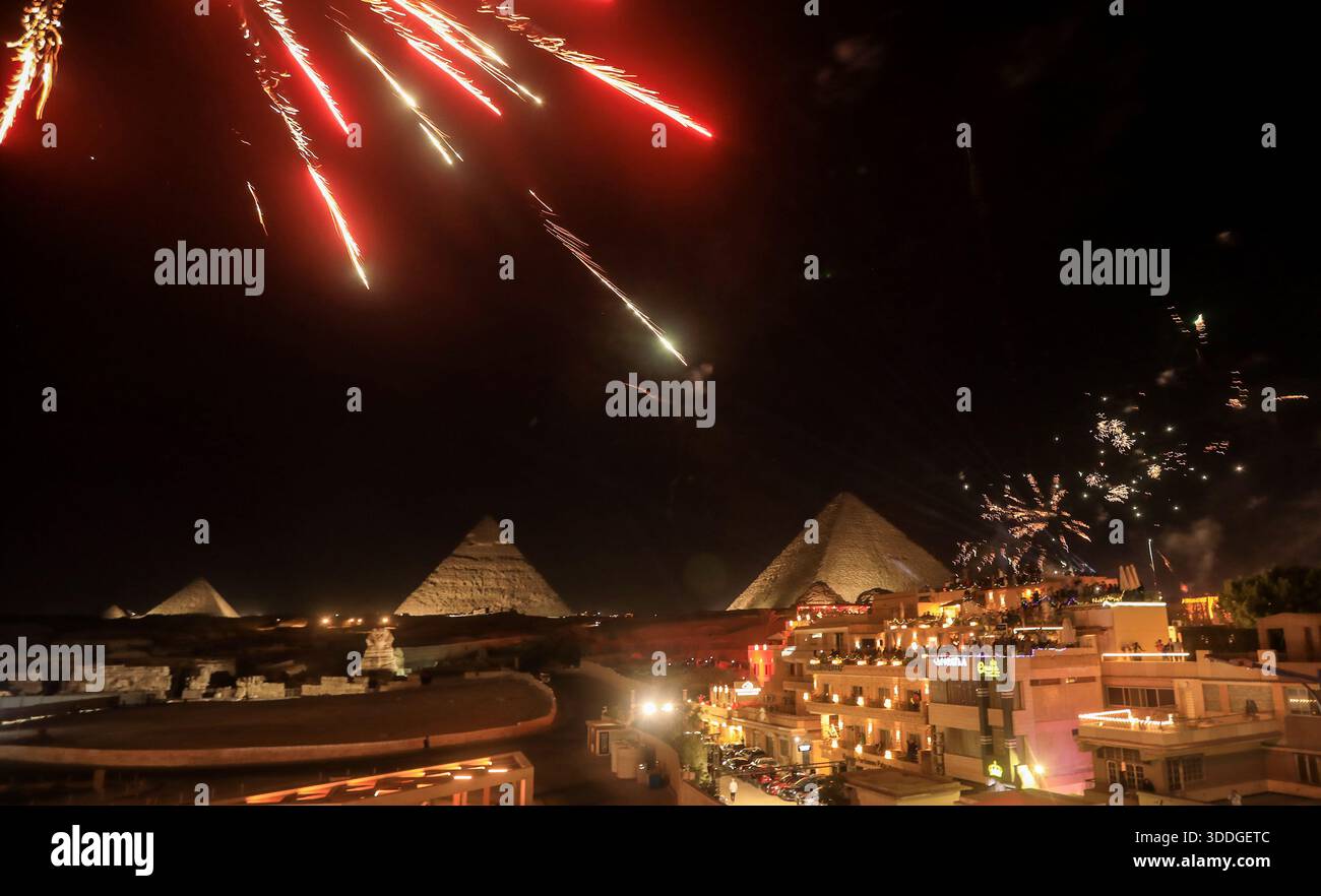 Cairo, Egypt. 31st Dec, 2025. Fireworks light up the sky above the ...