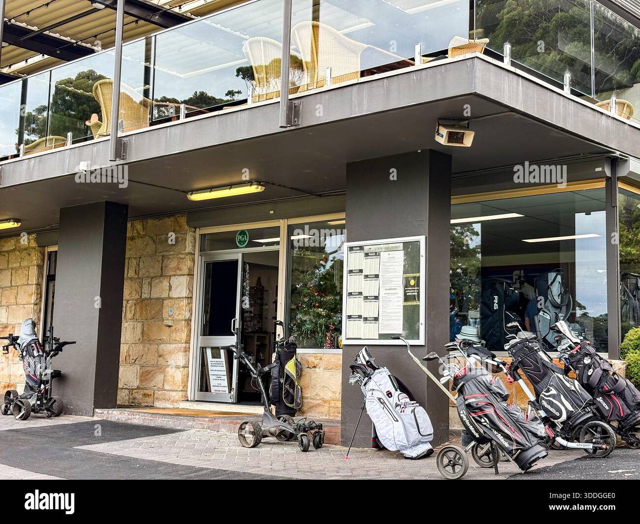 Cromer Golf Club and golf course, entrance to PGA pro shop with golf bags and trolleys outside,Sydney,NSW,Australia - Smartphone Captured Stock Image