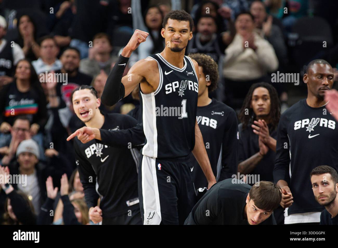 San Antonio Spurs center Victor Wembanyama (1) celebrates a basket during  the second half of an NBA basketball game against the New York Knicks,  Wednesday, Dec. 31, 2025, in San Antonio. (AP