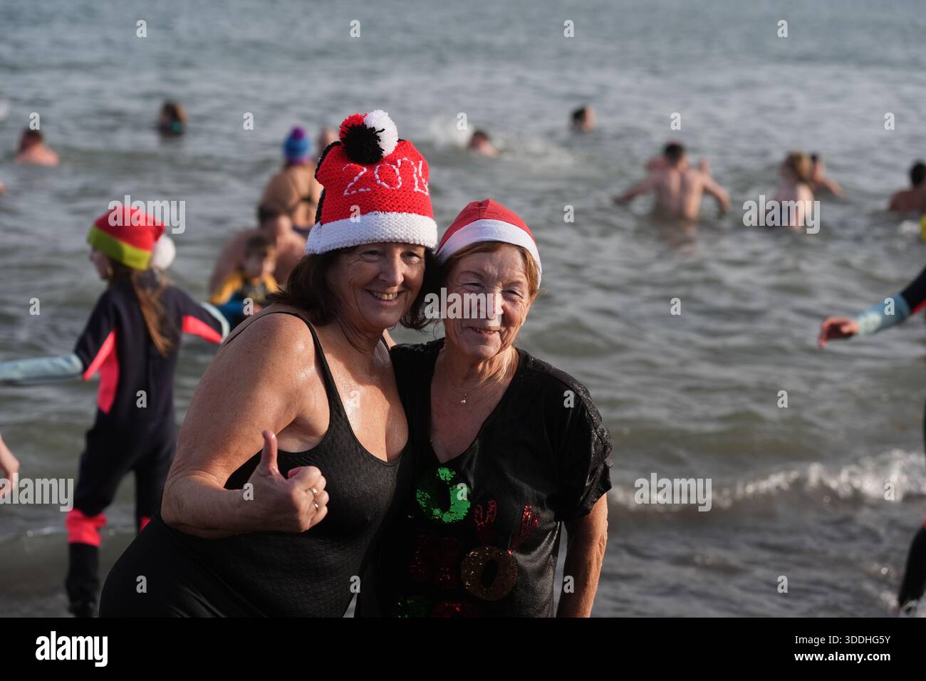 Swimmers take part in the annual New Year’s Day charity swim on Bray ...