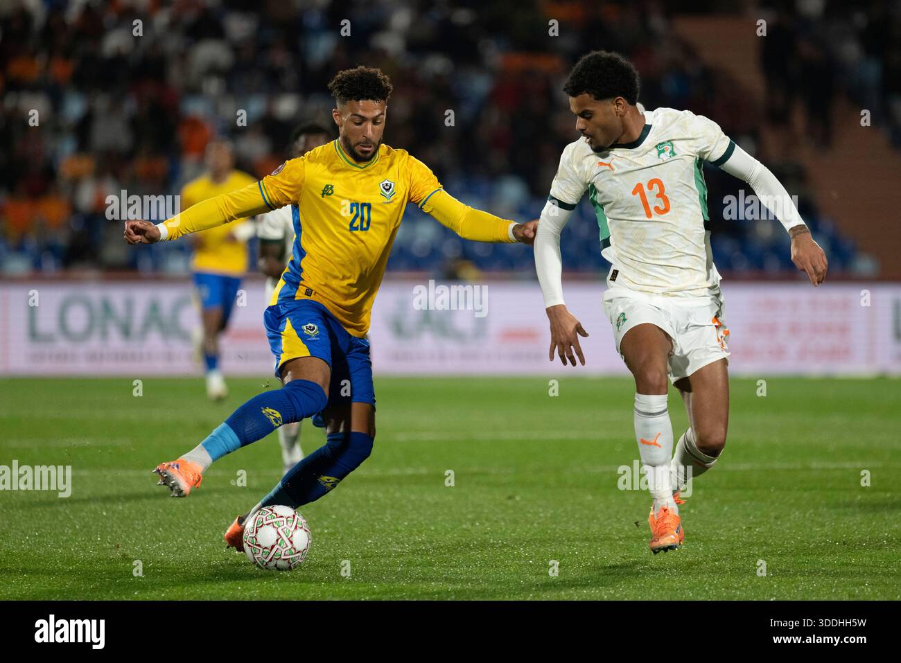 Marrakesh, Morocco. 31st Dec, 2025. Denis Bouanga of Gabon and Christopher  Opéri of Côte d'Ivoire during the Africa Cup of Nations (CAN) 2025 Group F  football match between Gabon and Côte d'Ivoire