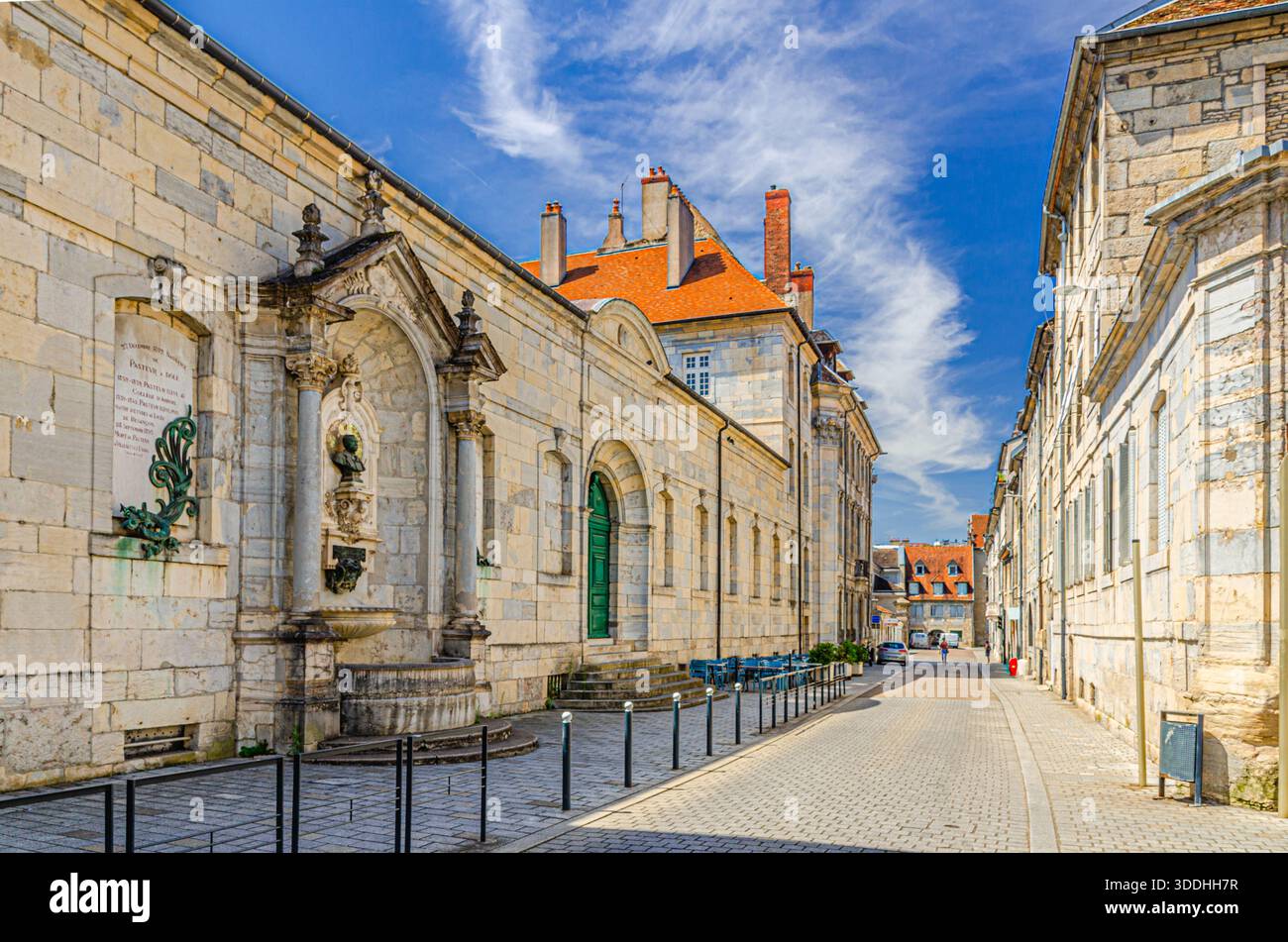 Besancon, France, July 10, 2024: Middle School Victor Hugo Lycee building and Fontaine du Lycee fountain on Rue du Lycée street in Besancon old town c Stock Photo