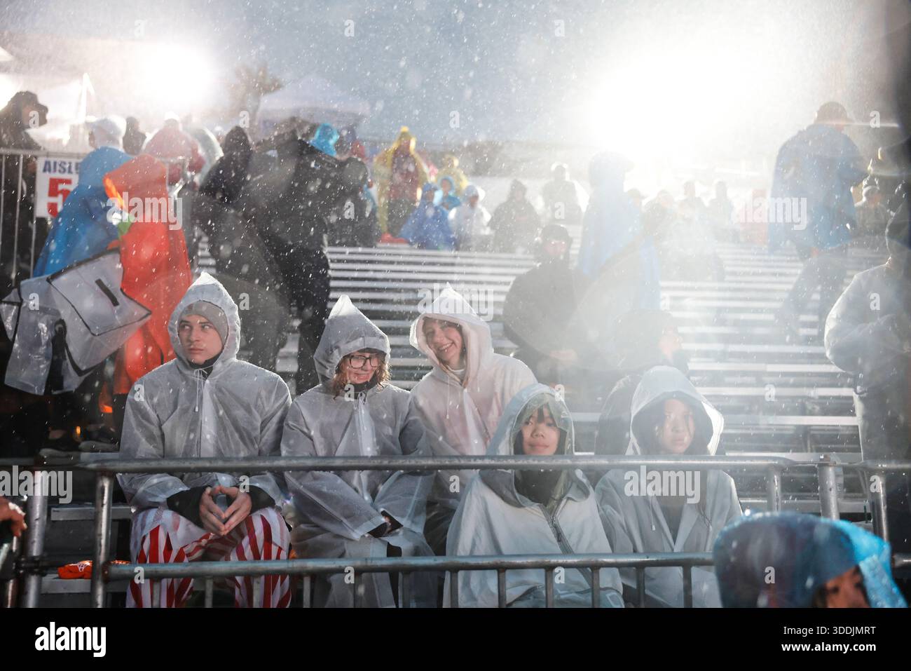 Rain comes down on attendees at the 137th Rose Parade Thursday, Jan. 1 ...