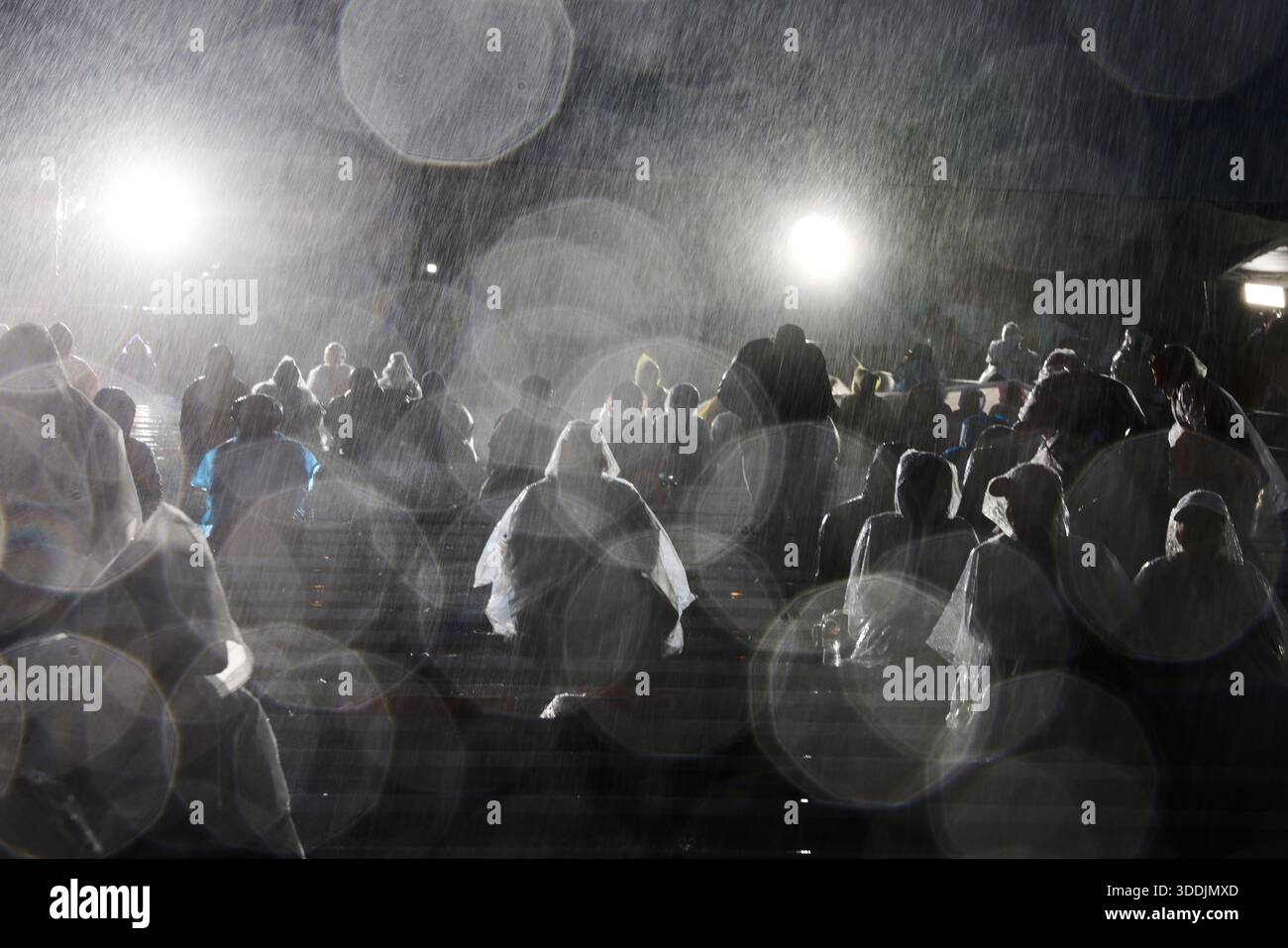 Rain comes down on attendees at the 137th Rose Parade Thursday, Jan. 1 ...