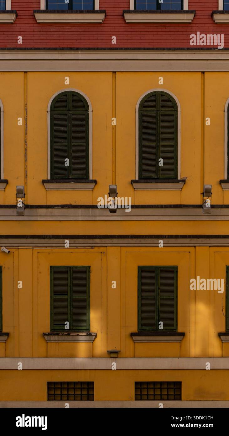 A 9:16 Portrait image of brightly coloured buildings in the centre of Tirana, Albania - Stock Image