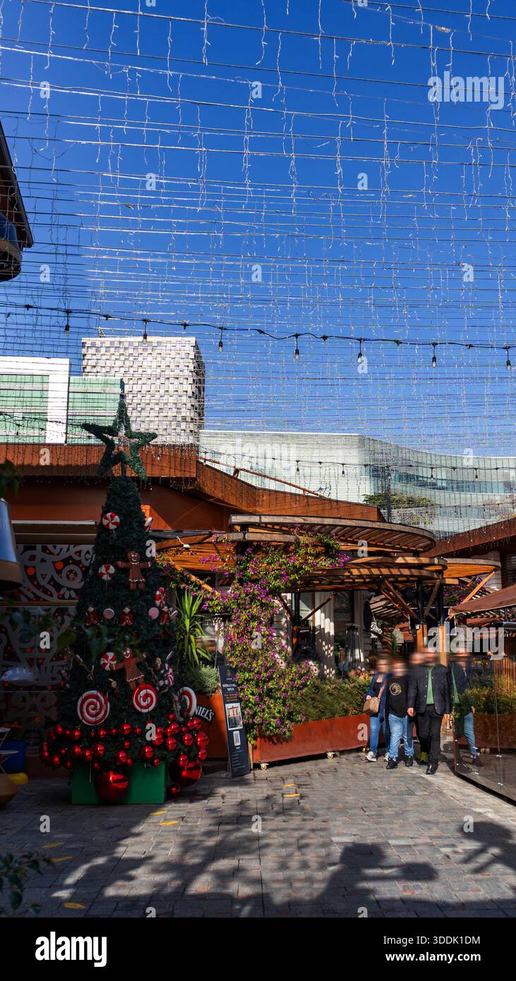 A 9:16 Portrait image of Christmas decorations inside the Tirana Castle in Albania - Stock Image