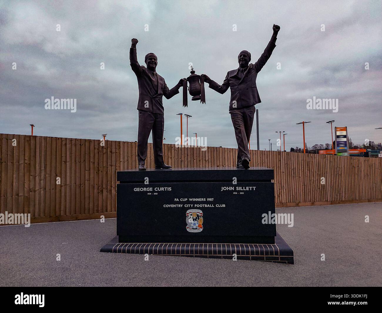 The statue of George Curtis and John Sillett who won the FA Cup in 1987 outside the CBS Arena in Coventry, West Midlands, UK - Stock Image