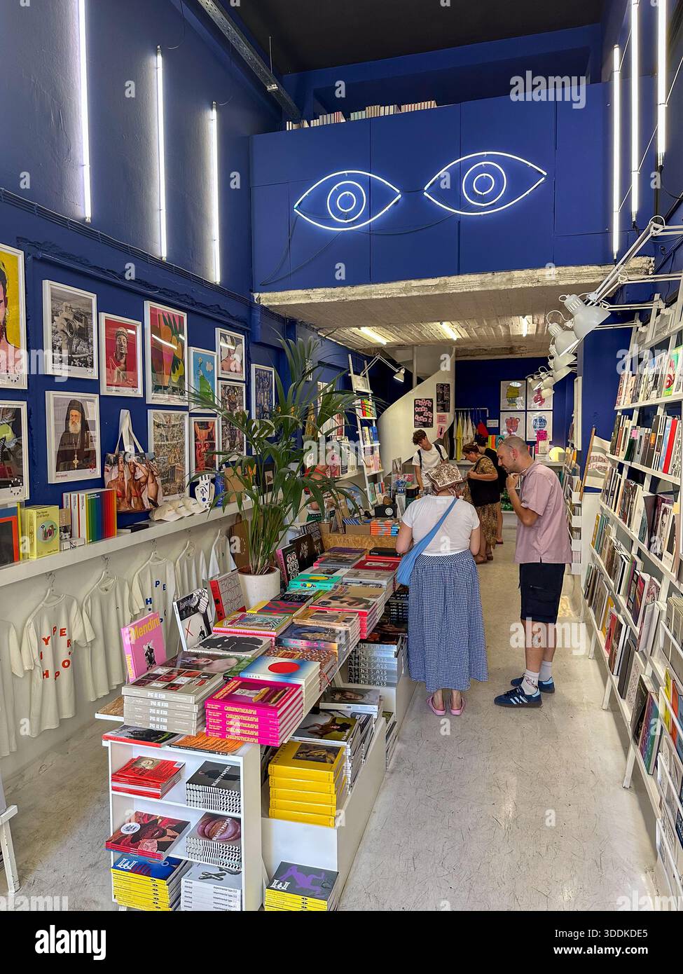 Customers browsing art books inside Hyper Hypo bookstore, Monastiraki, Athens, Greece Stock Photo
