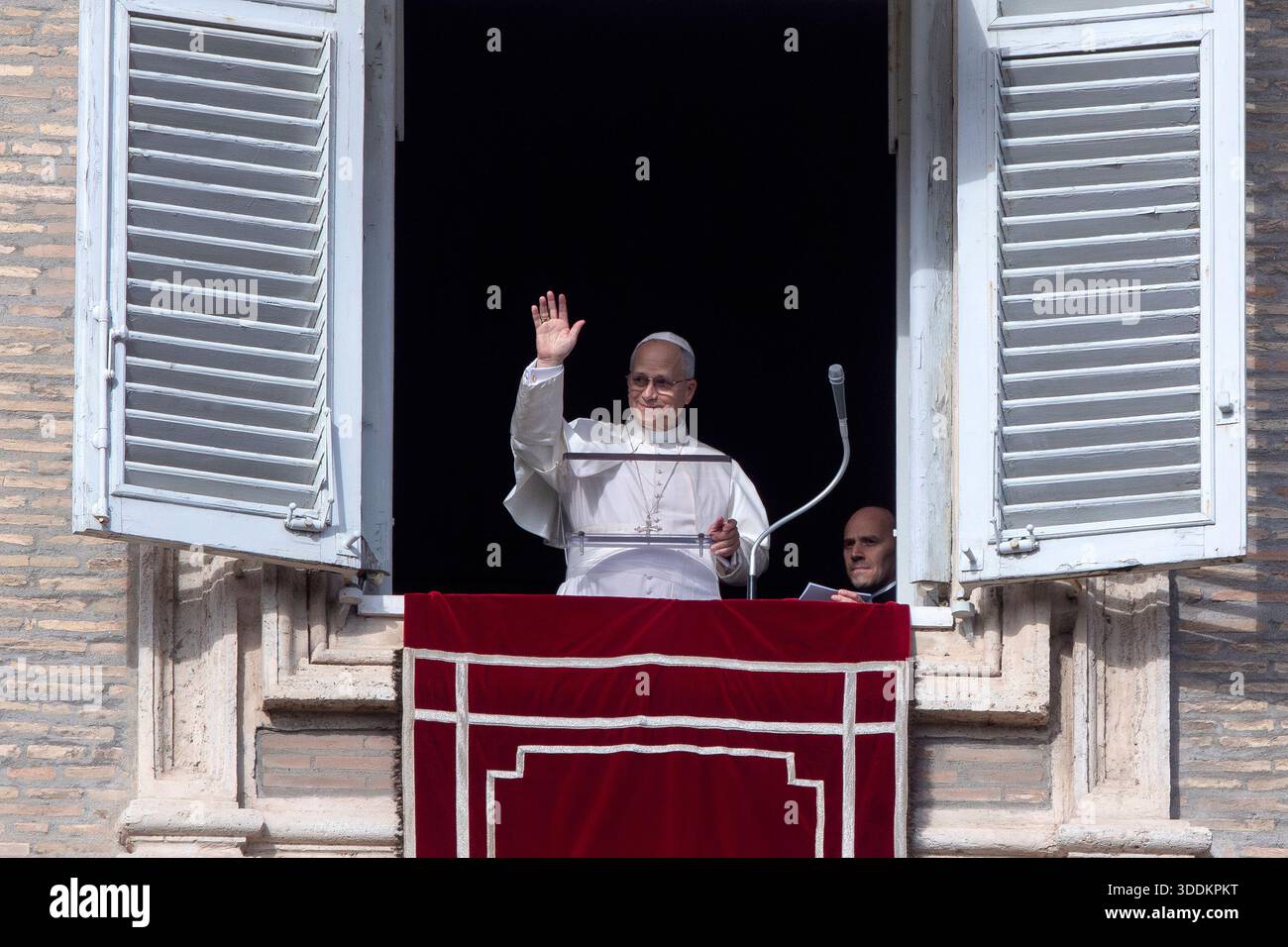 Pope Leo XIV delivers the Angelus prayer from the window of his studio ...