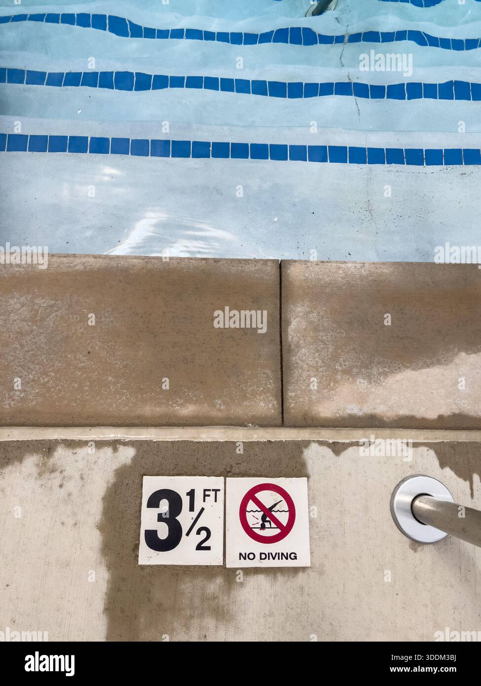 A 3 FT depth label with a 'No Diving' icon is embedded in concrete ...