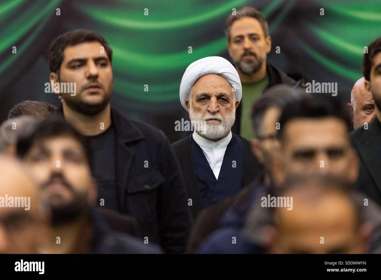 Gholamhossein Mohseni Ejei (center), head of Iran’s judiciary, stands ...