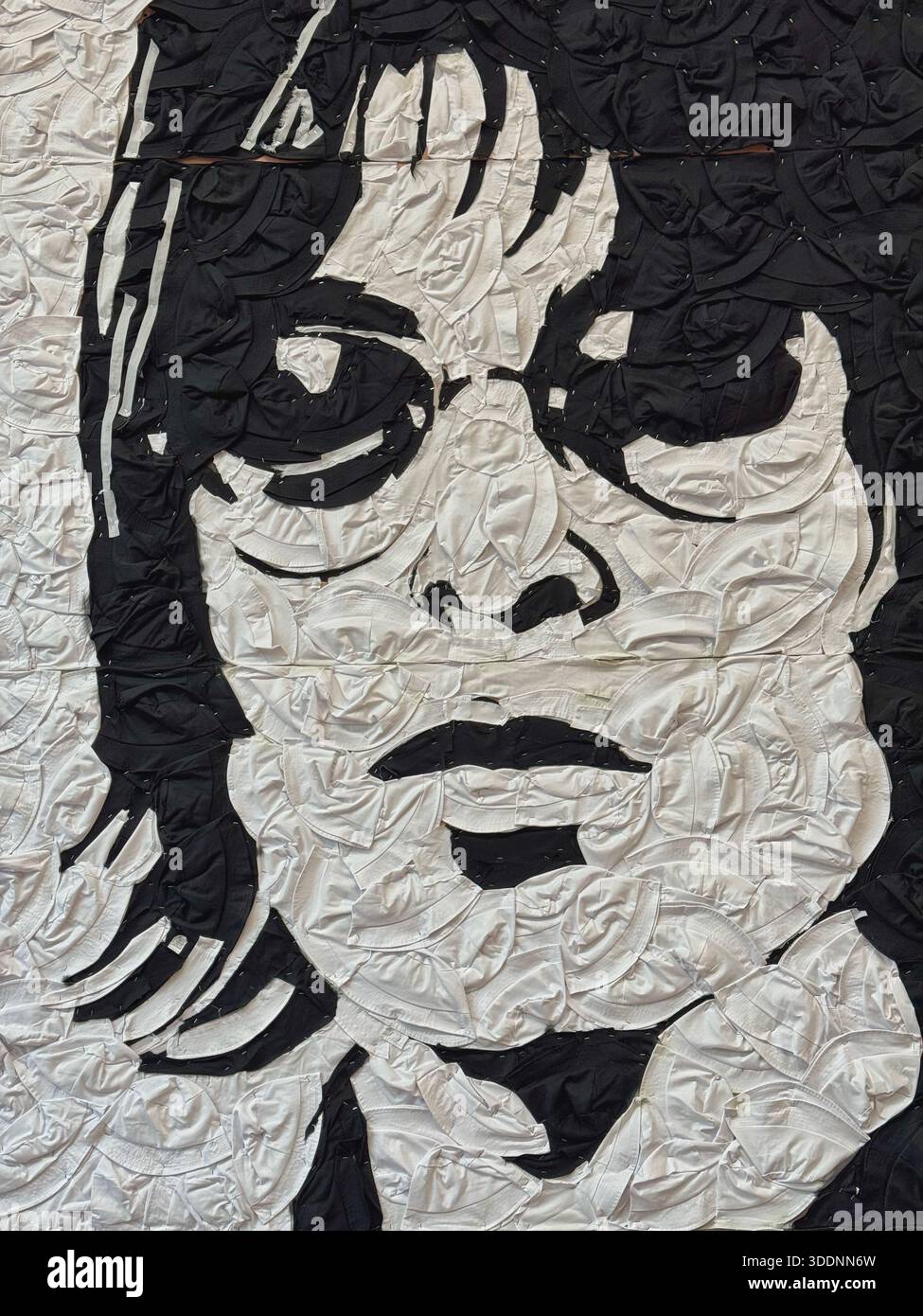 Hail Noel and hail RKID portrait in Cardiff, made of bucket hats, to commemorate the start of the OASIS reunion tour, 2025. - Smartphone Captured Stock Image