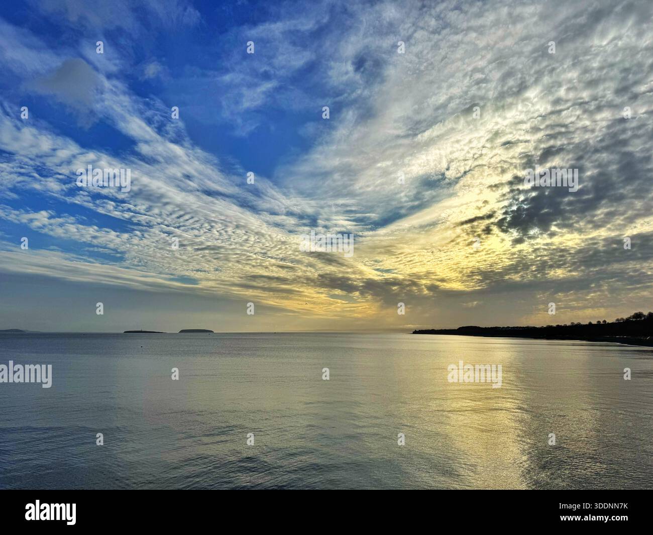 View westwards from Penarth Pier on a winter's evening with lovely light and clouds. - Smartphone Captured Stock Image