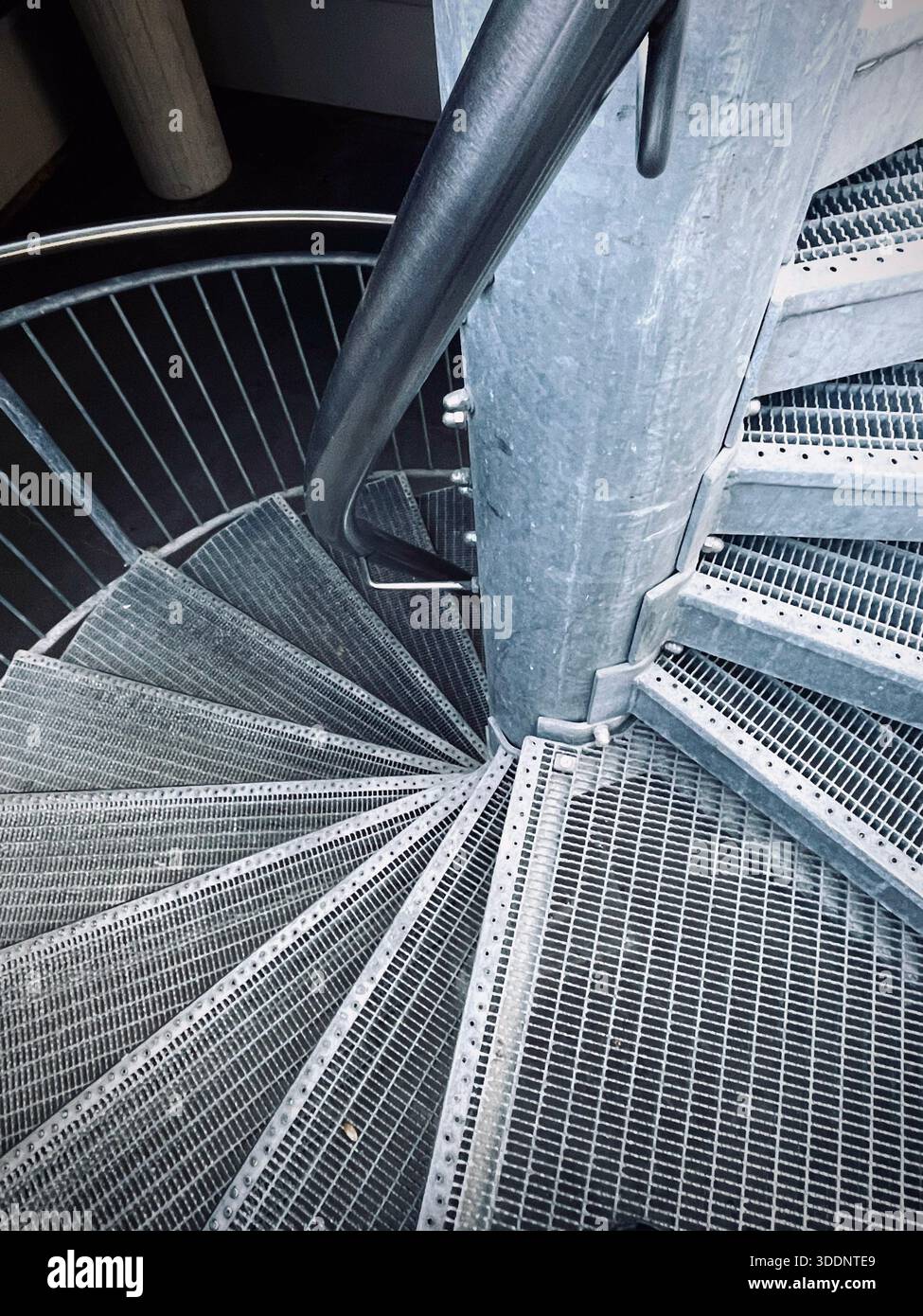Metal spiral staircase with geometric pattern - Smartphone Captured Stock Image