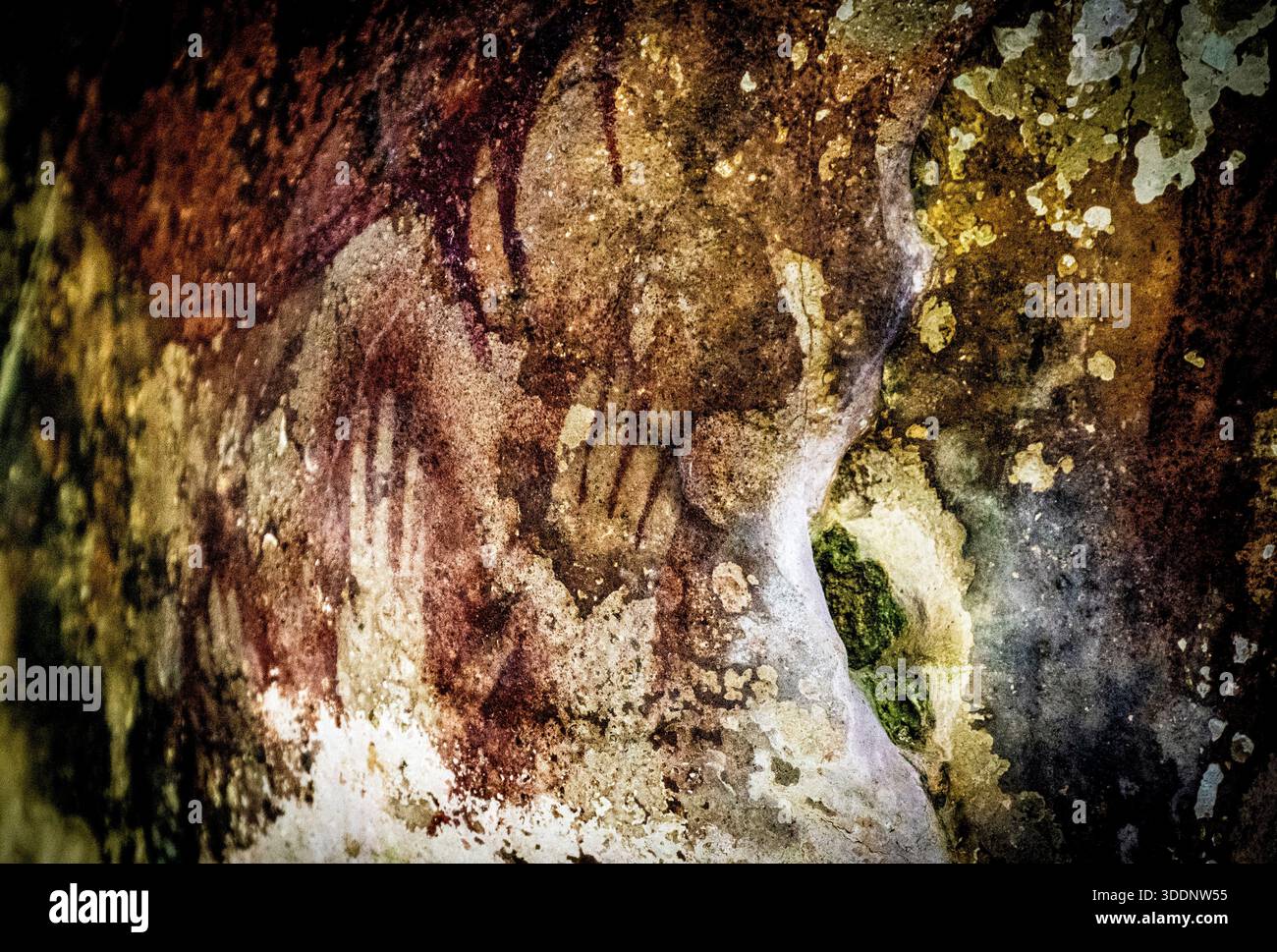 Cave Patterns Ancient cave painting with handprints and abstract patterns on a ...