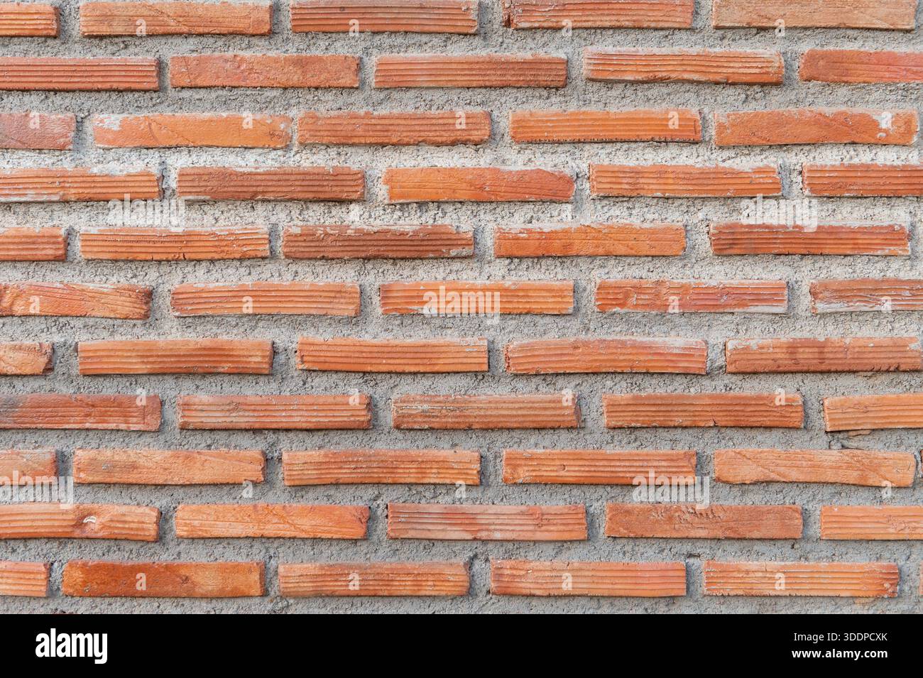 Red brick wall texture forming classic architectural background Stock Photo