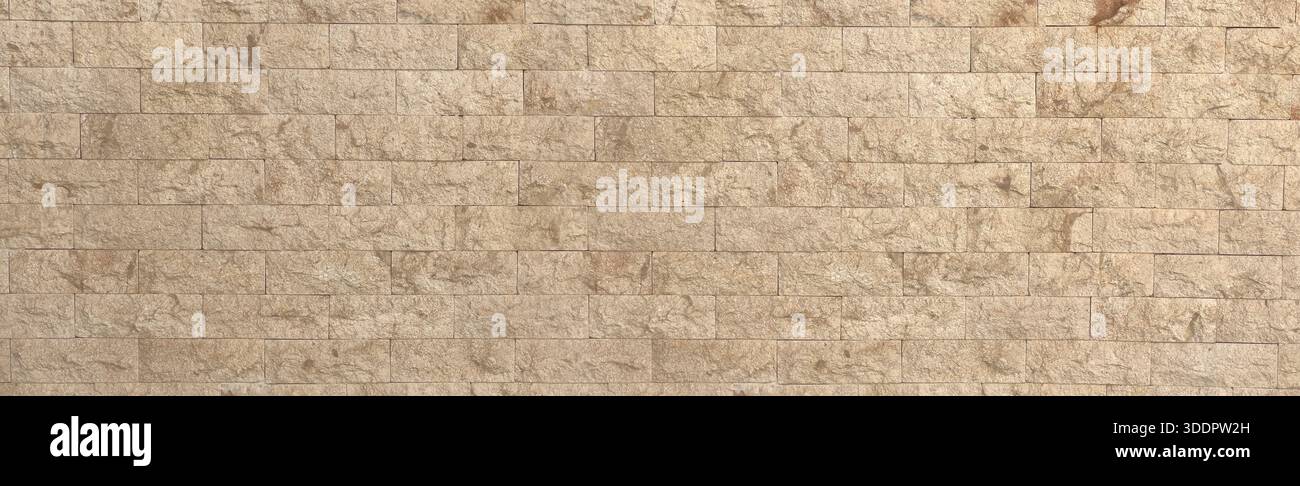 Beige rough stone wall texture creating a natural tiled masonry background Stock Photo