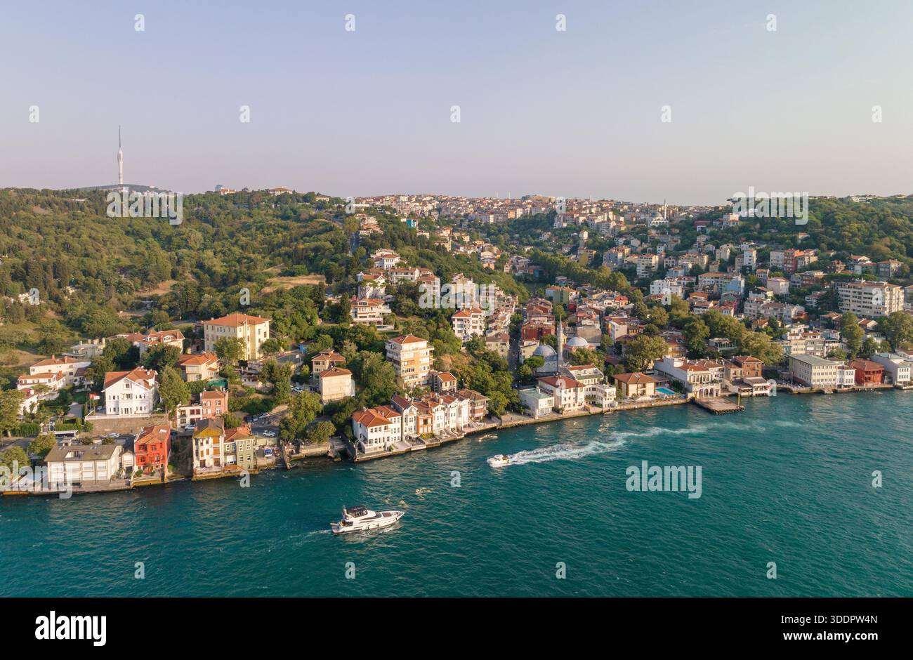 An aerial shot captures a vibrant coastal cityscape with diverse ...