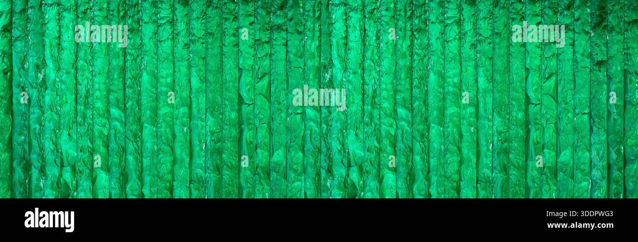 Green translucent textured glass stacked creating an abstract background or pattern Stock Photo