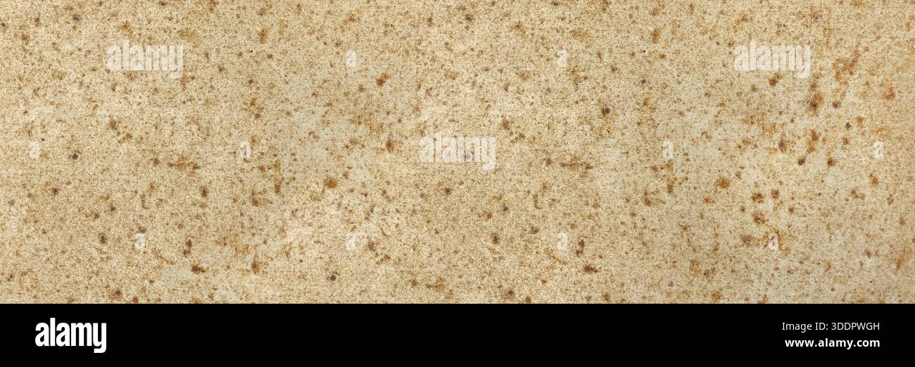 Beige granite stone surface showing natural textured pattern ideal for backgrounds Stock Photo