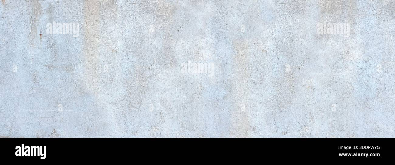 Grey concrete wall creating a textured grunge background Stock Photo