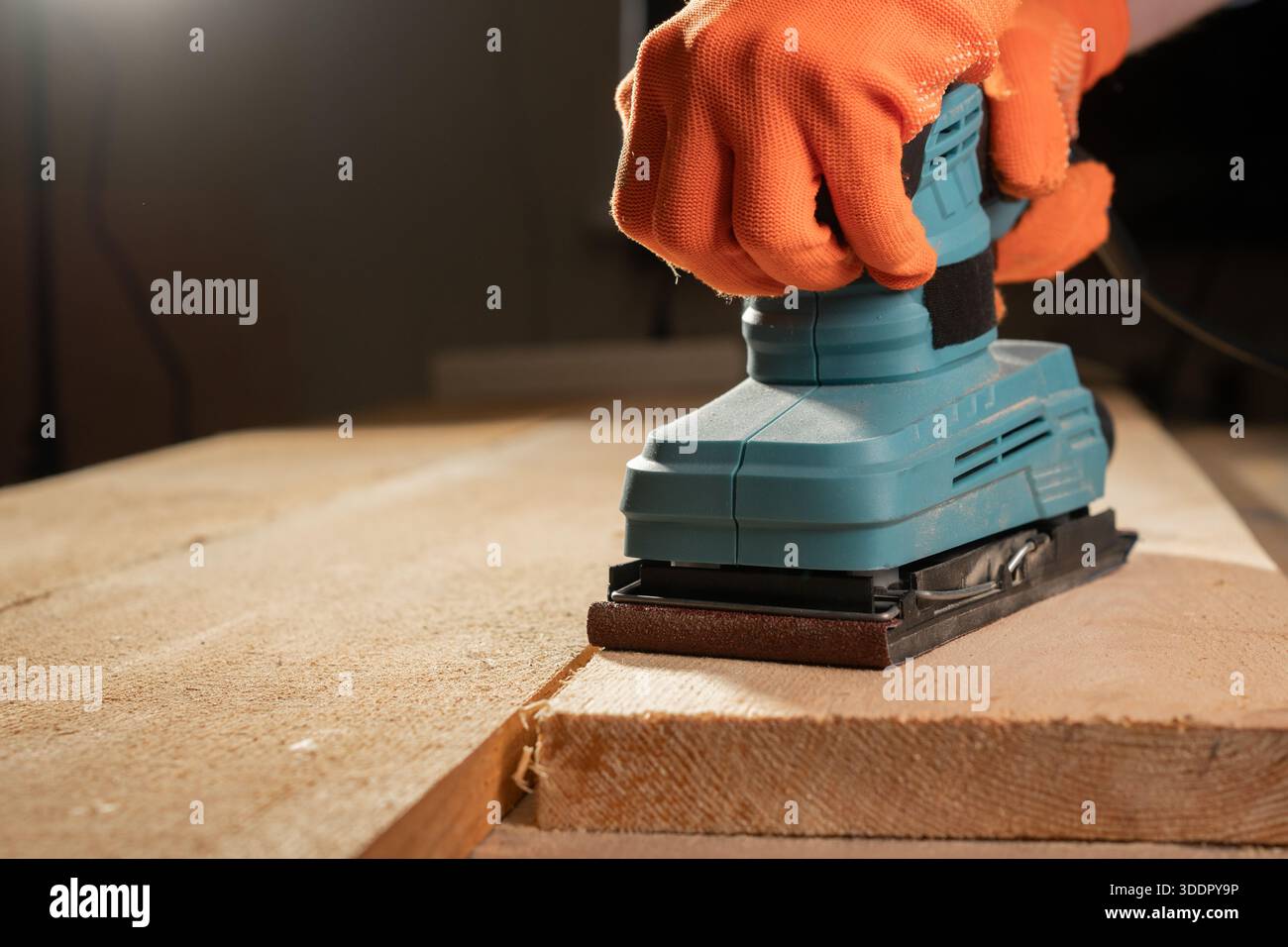 male hands using with sander machine on construction concept. Stock Photo
