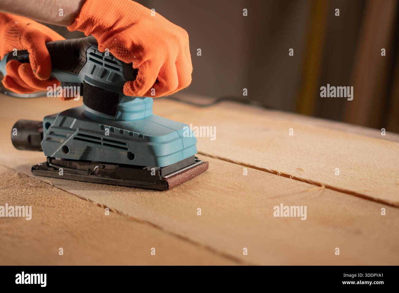male hands using with sander machine on construction concept. Stock Photo