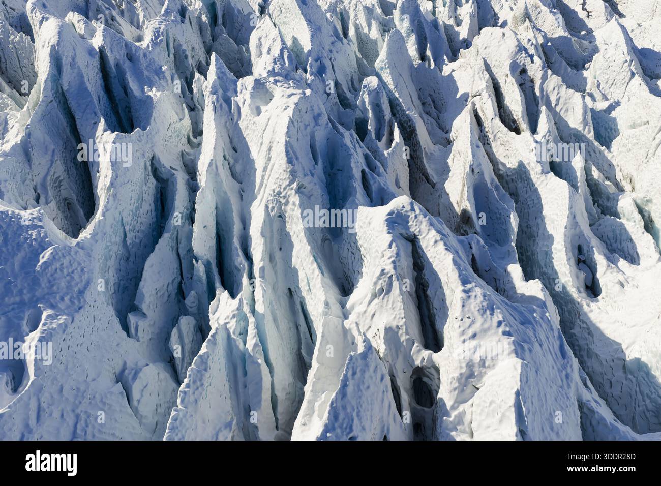 Aerial view of glacial ice formations sculpted by wind and time ...