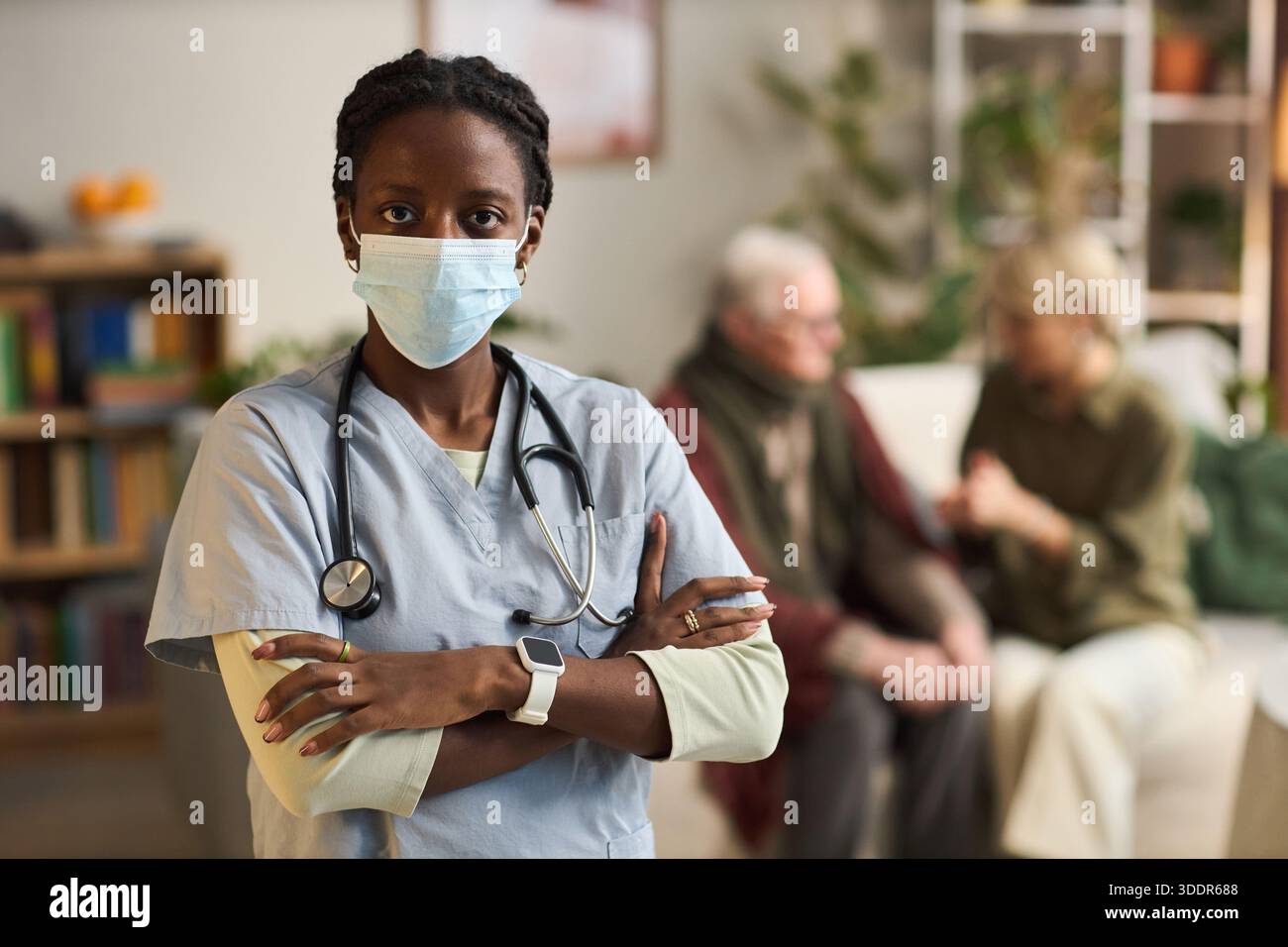 Portrait nurse wearing scrubs sitting hi-res stock photography and ...