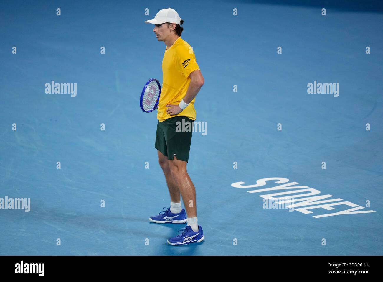 Alex De Minaur of Australia looks down the court after losing a point ...