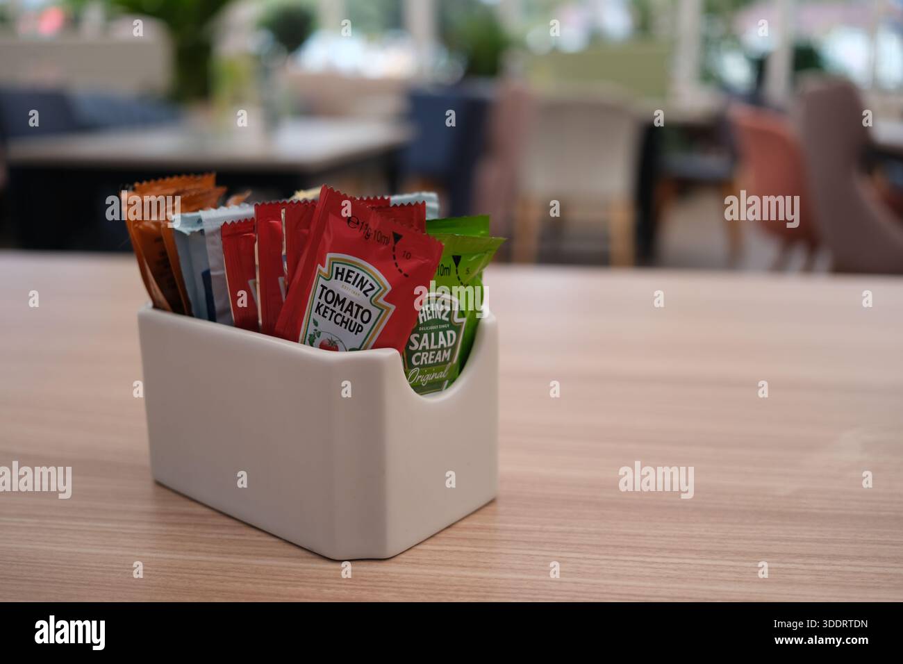 Sachets of Heinz individual condiments including tomato ketchup and ...