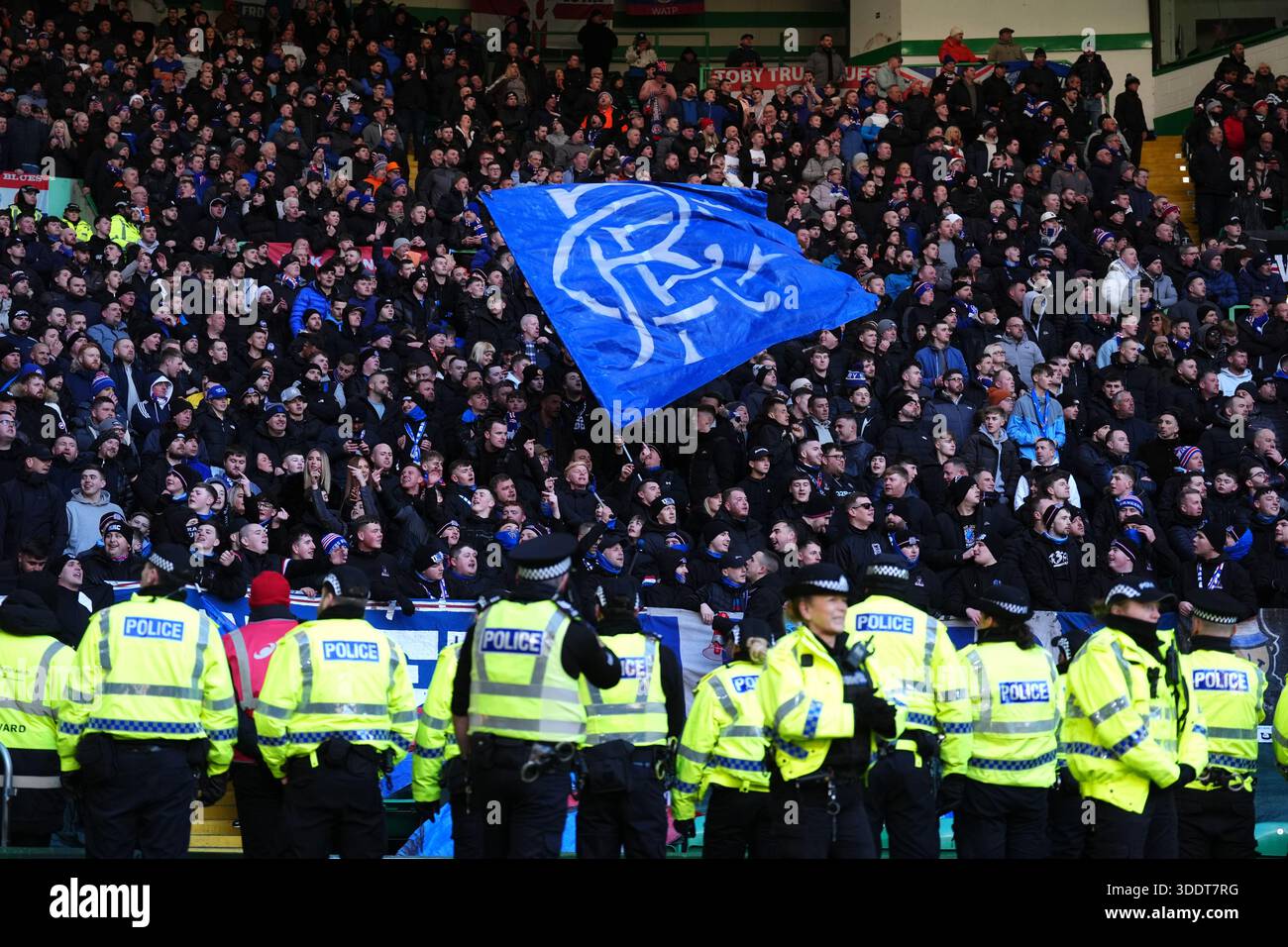 Police officers stands in a line in front of Rangers fans during the ...