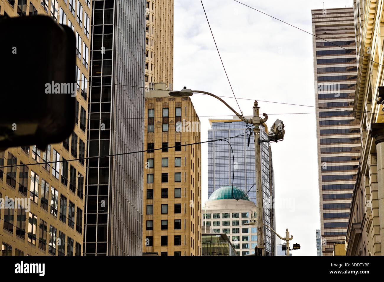 Downtown Seattle street view framed by tall office towers, power lines ...