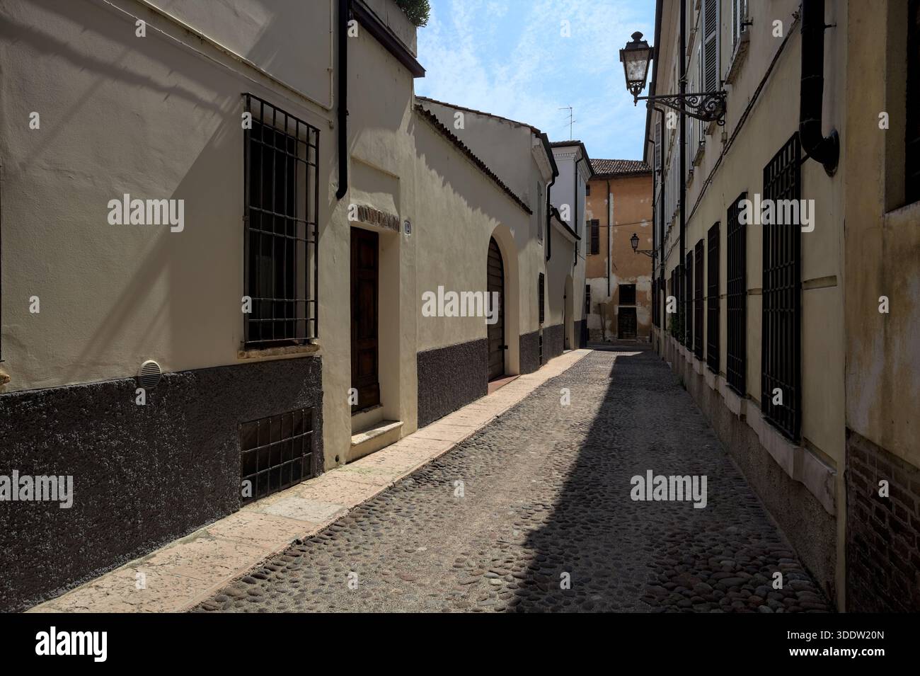 Street half in the shade on a sunny day Stock Photo