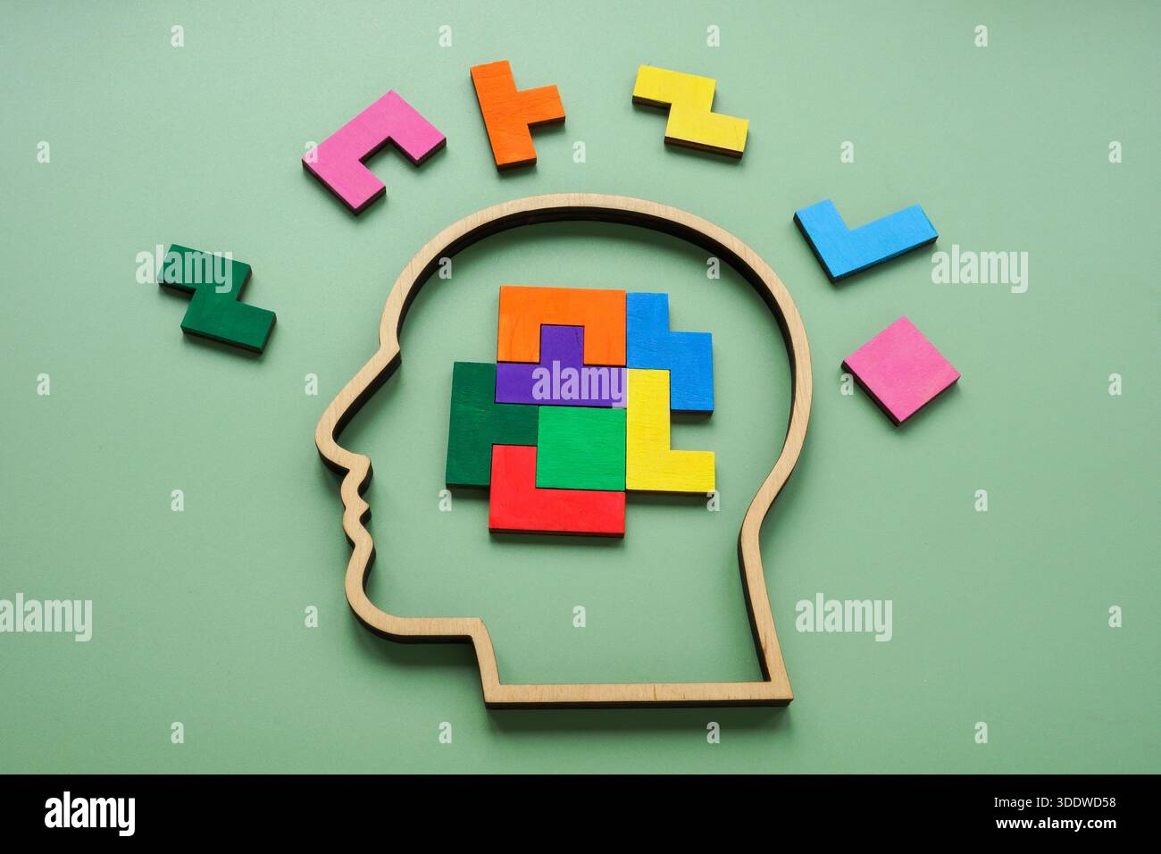 Human head with colorful puzzle pieces. Creative thinking. Stock Photo