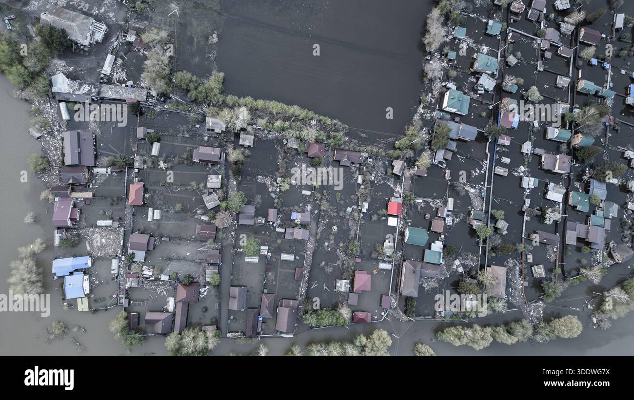 Aerial drone footage of a massive city flood with houses and streets ...