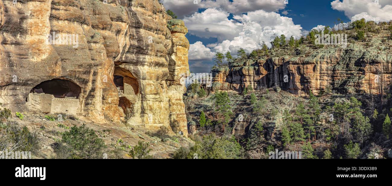 The Gila Cliff Dwellings occupy natural alcoves in the rugged canyons of the Mogollon Mountains, where the Mogollon Culture built multi-room stone and Stock Photo