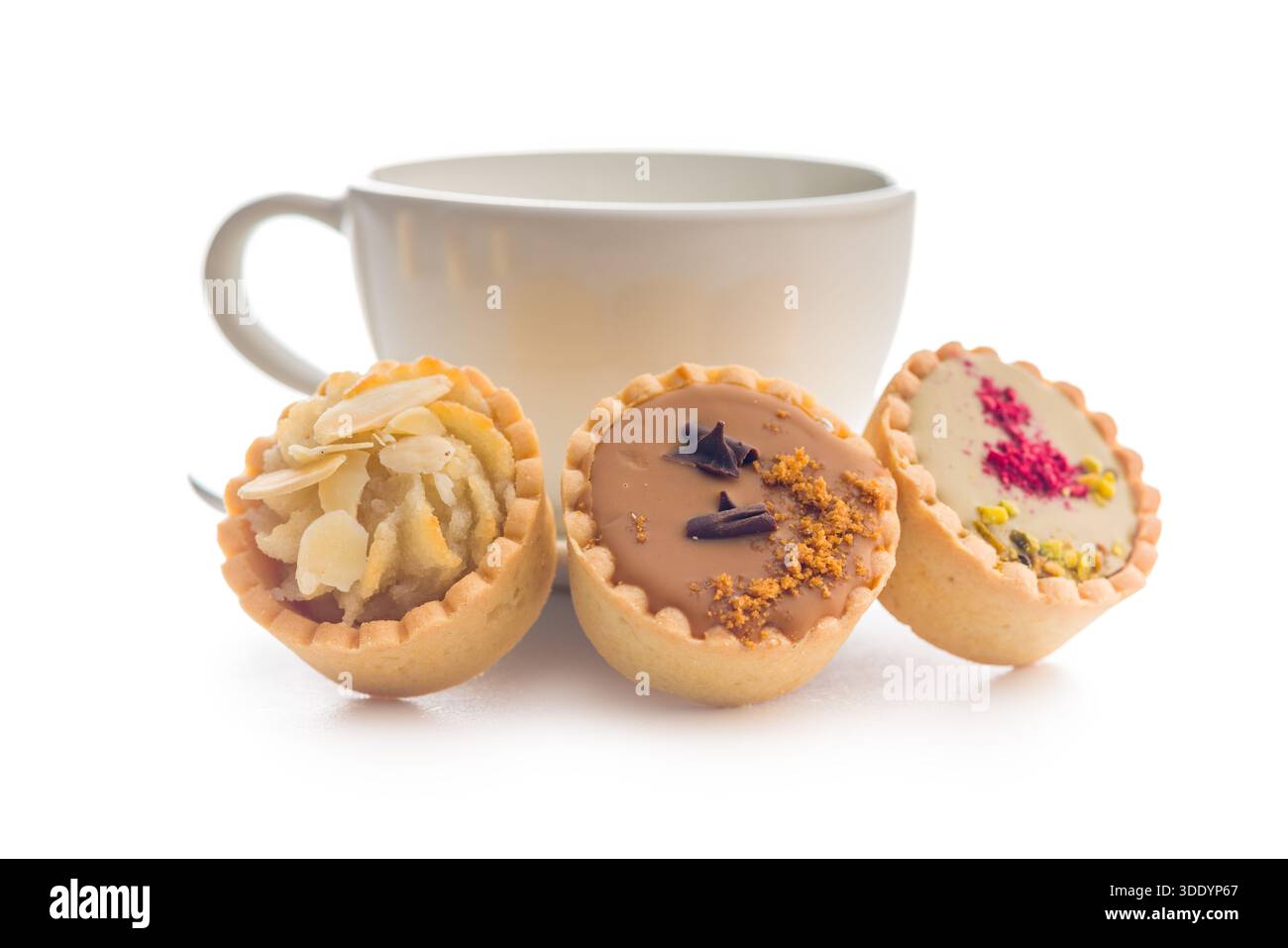 Sweet mini tartlets and coffee cup isolated on a white background. Stock Photo