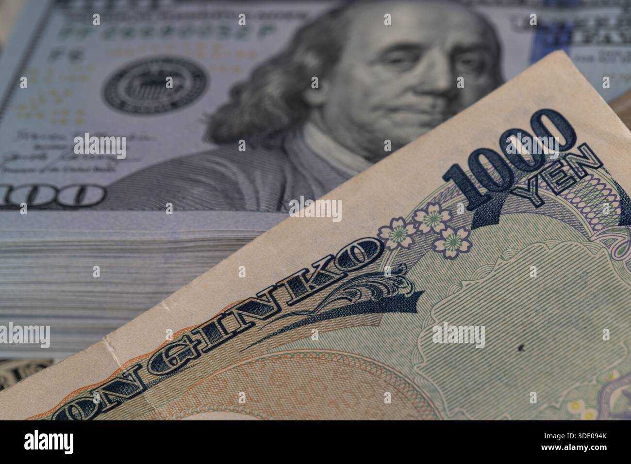 Japanese 1000 Yen Note on Stacks of US Dollars Stock Photo - Alamy