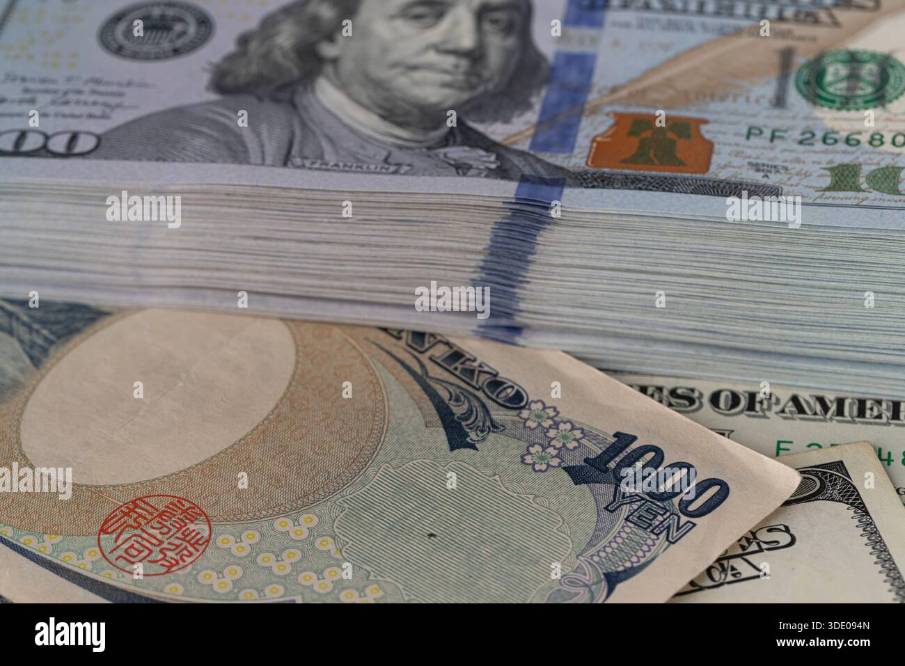 Japanese 1000 Yen Note on Stacks of US Dollars Stock Photo - Alamy