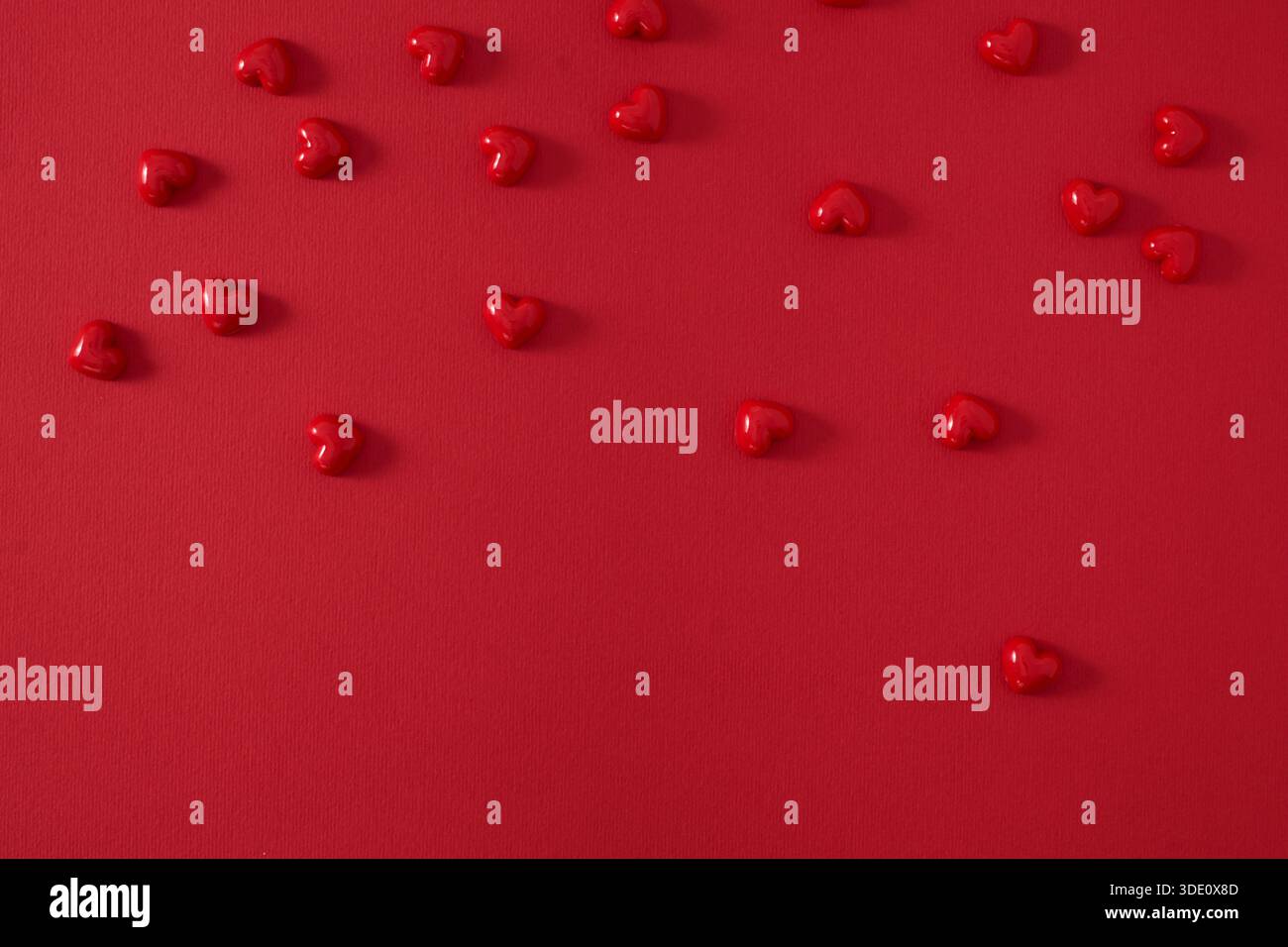 Small hearts on a red background Stock Photo