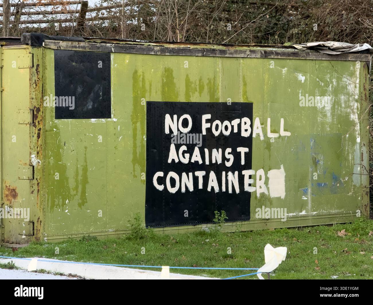 Metal storage containers with No Football sign - Smartphone Captured Stock Image